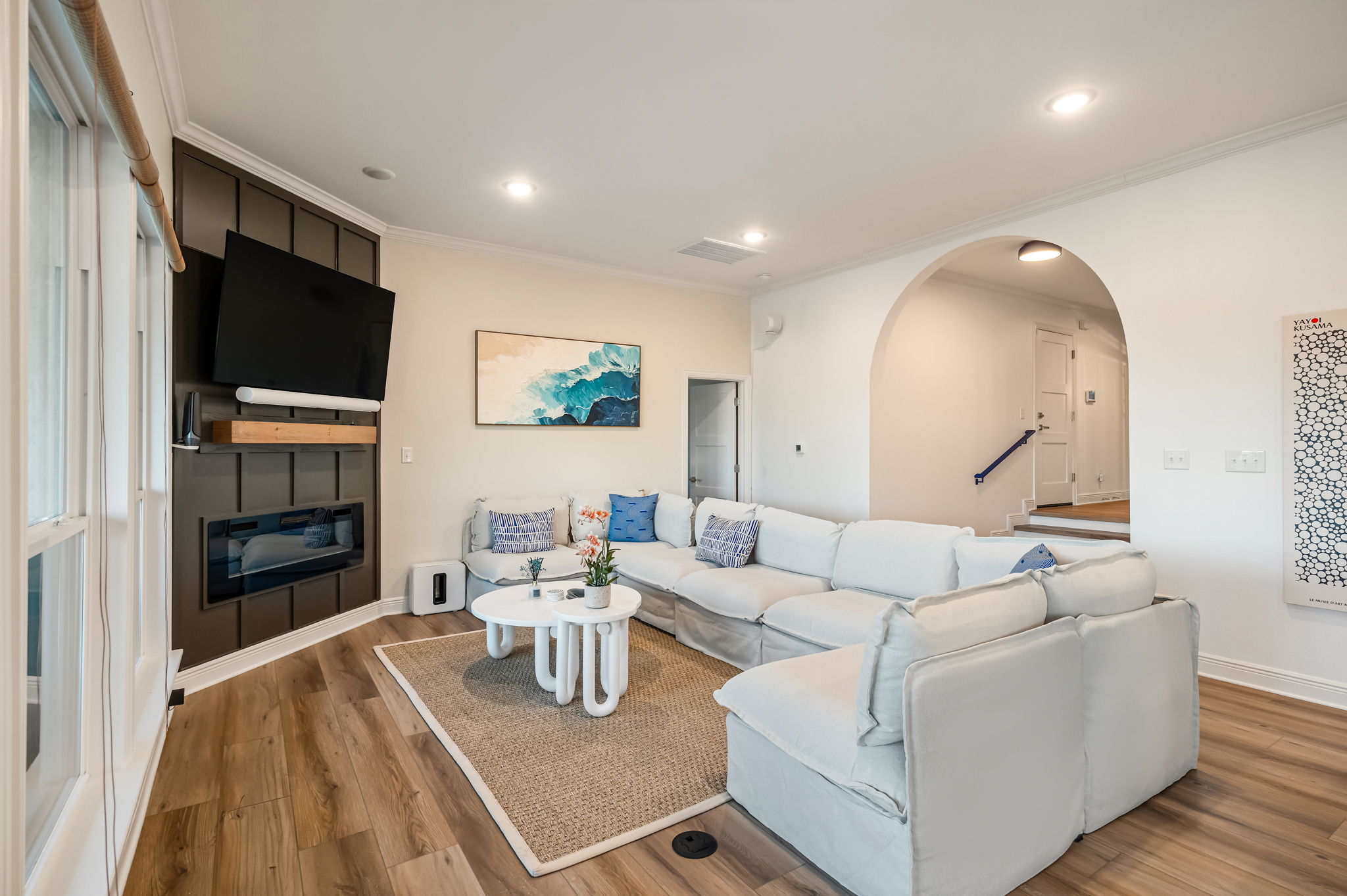 Bright and spacious main living room with plush sectional and open-concept layout — perfect for group gatherings.