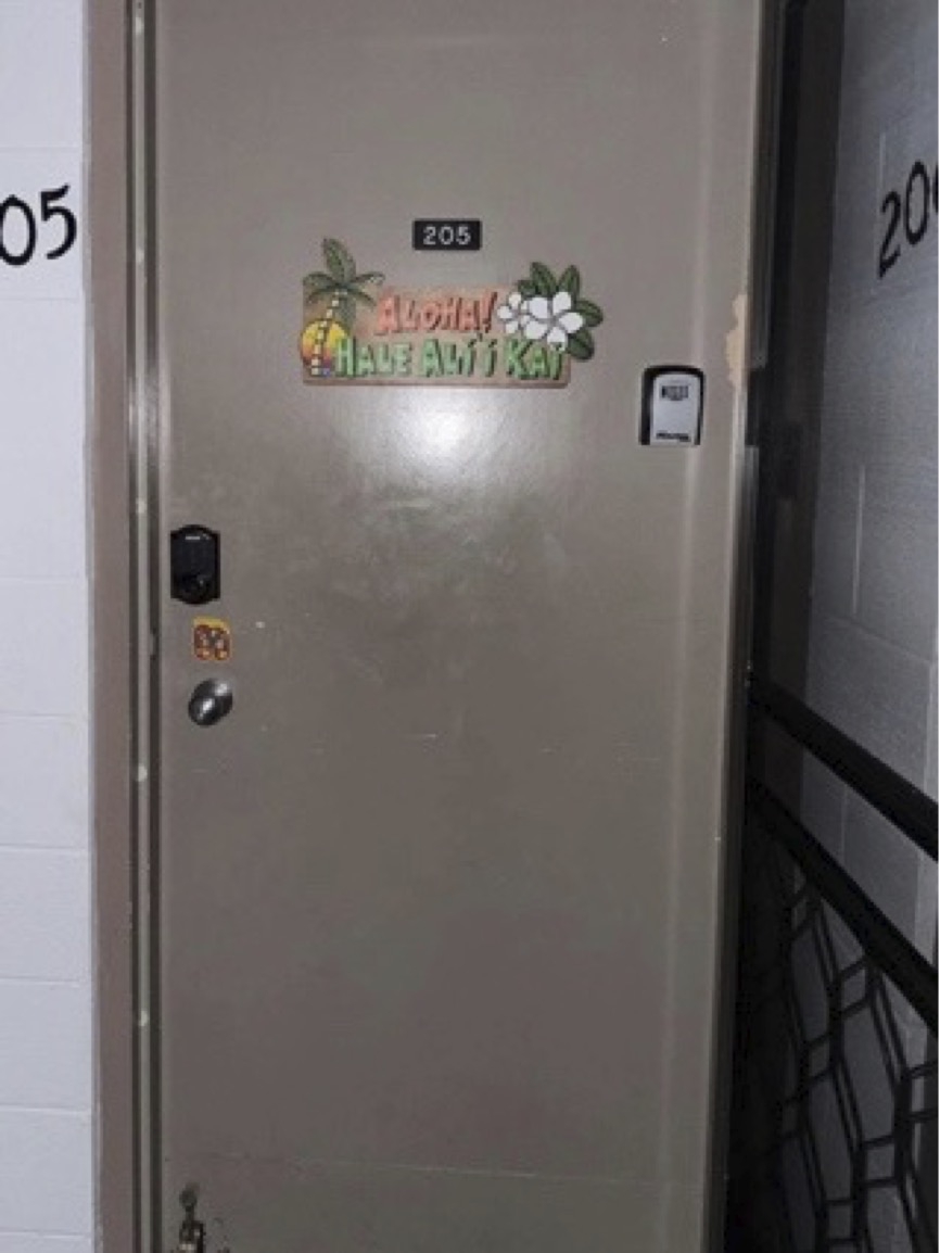 Front door to Unit 205 with Hale Ali'i Kai sign