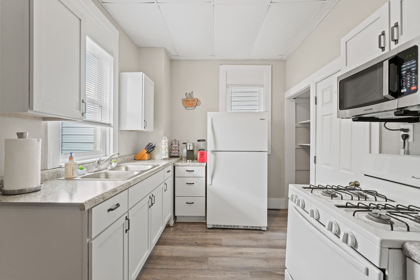 This kitchenette has everything you need, from a fridge to a stove and essential cookware.