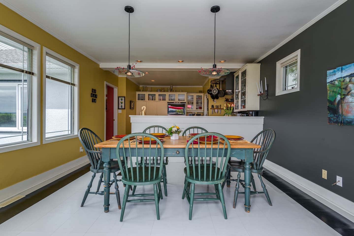 Dining room table seats six with 2 additional chairs available.