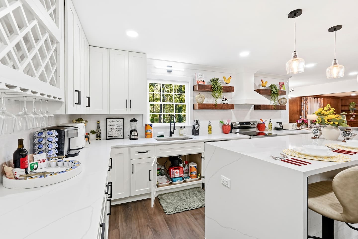 Beautiful white kitchen fully equipped with all the appliances and essentials of a home away from home. 