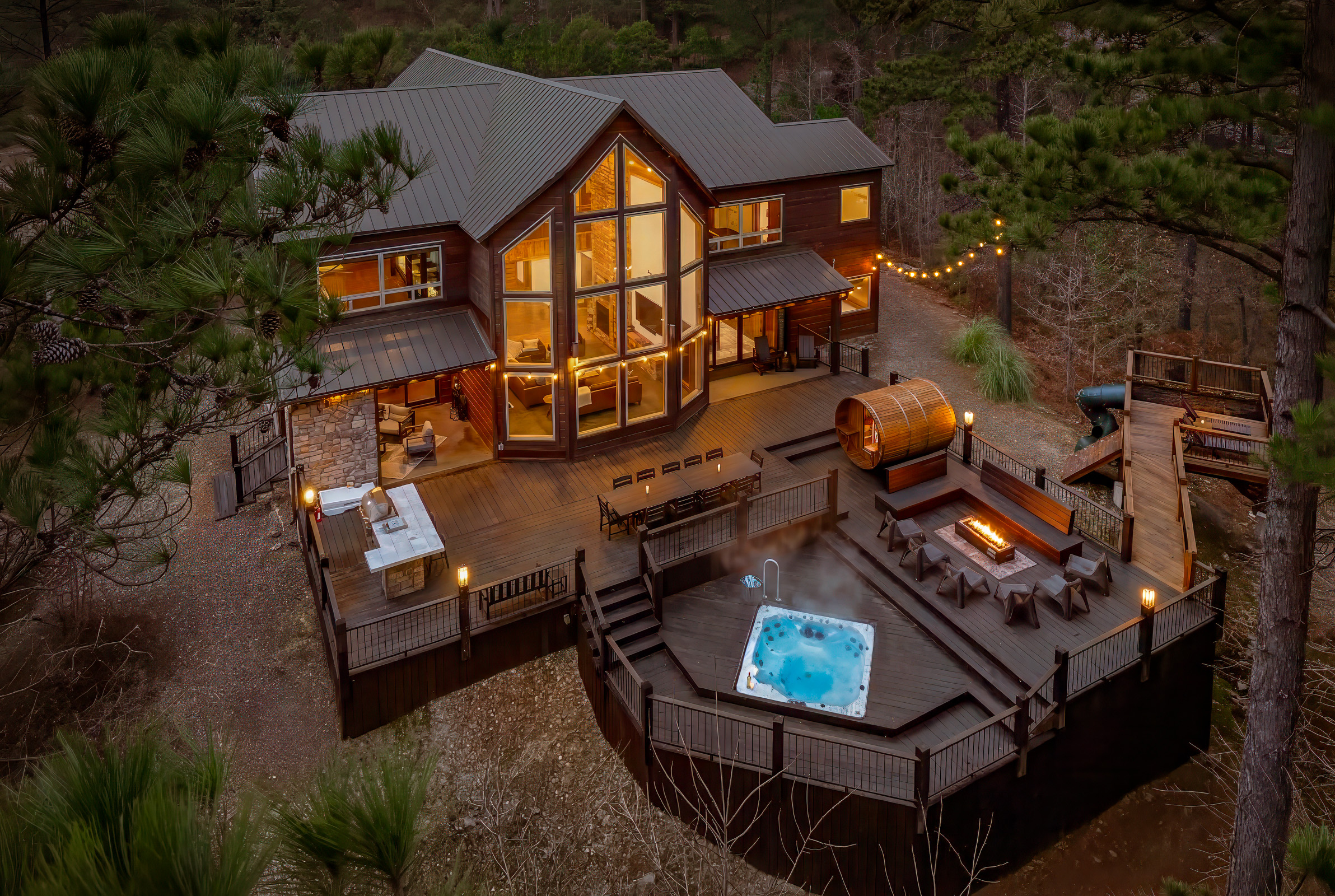 Hilltop views, glowing lights, and a sunken hot tub - your private outdoor retreat awaits!