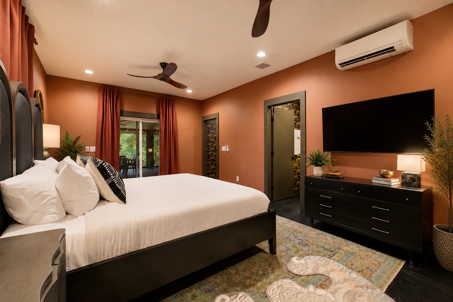 The primary bedroom below the main level includes a king bed, ensuite full bath and access to the screened in porch with ping pong table!