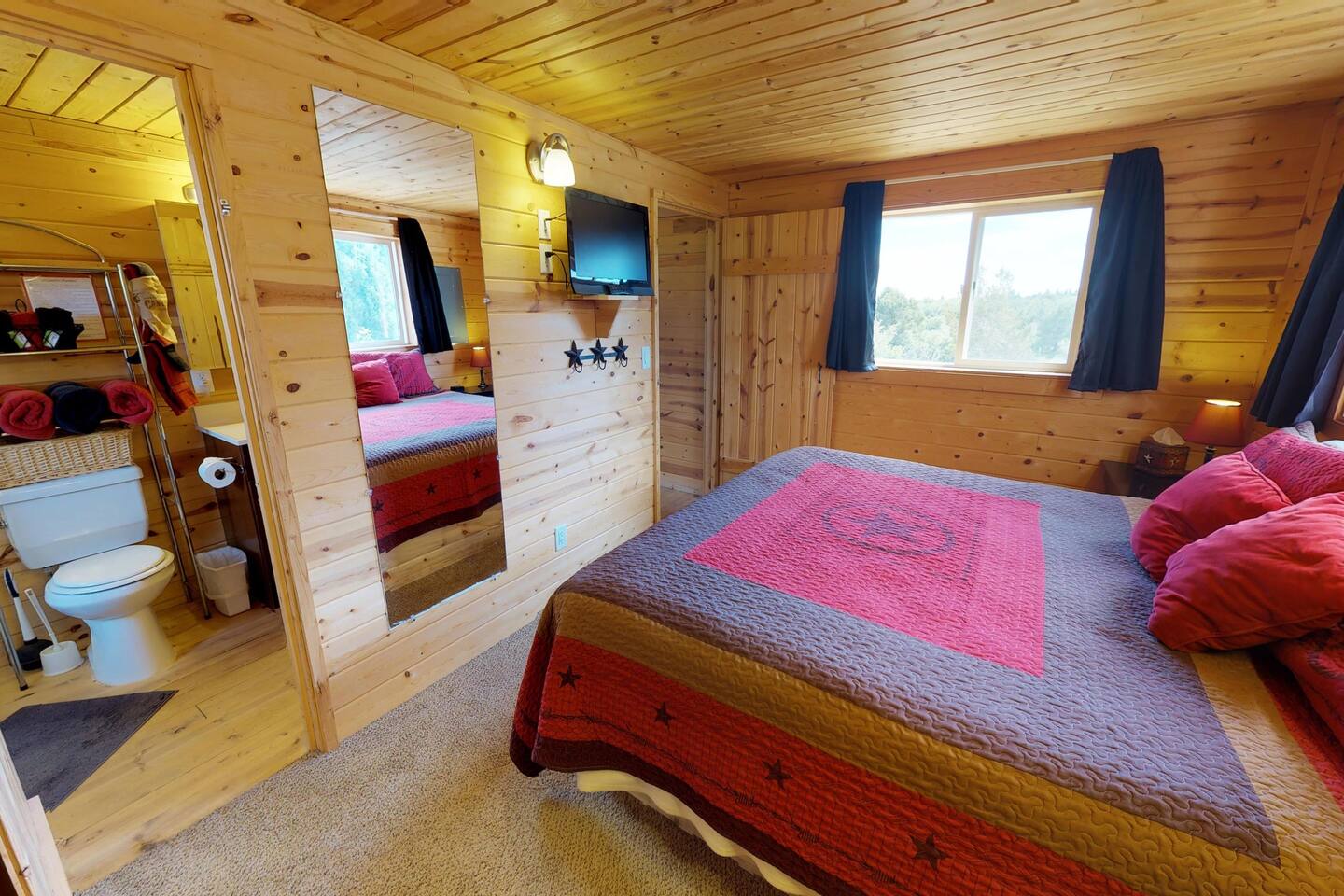 Queen sized bed in the master bedroom.