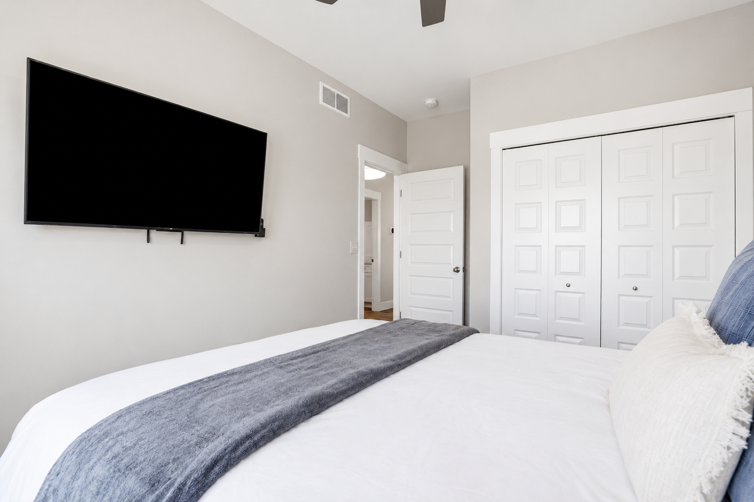 Whether you're winding down with your favorite show on the 55" Roku TV or unpacking with the luggage rack and closet space, this bedroom is designed to feel like home.