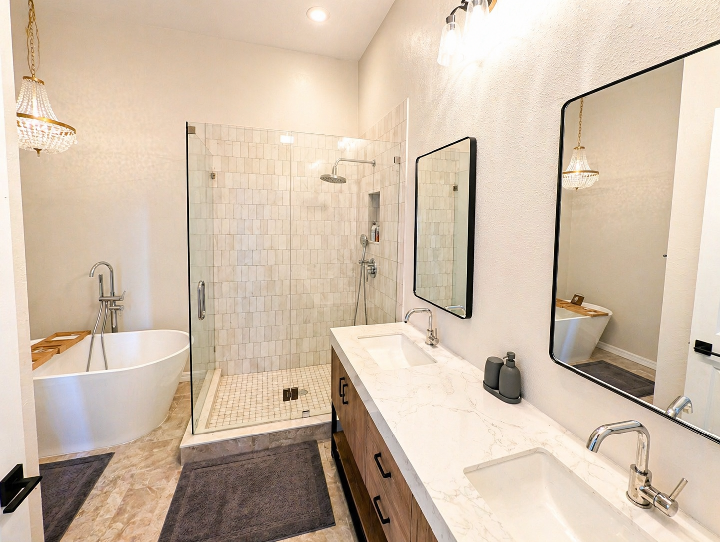 Relax and unwind in this spa-inspired bathroom featuring a deep soaking tub, elegant chandelier lighting, and calming modern décor designed for a luxurious retreat experience.