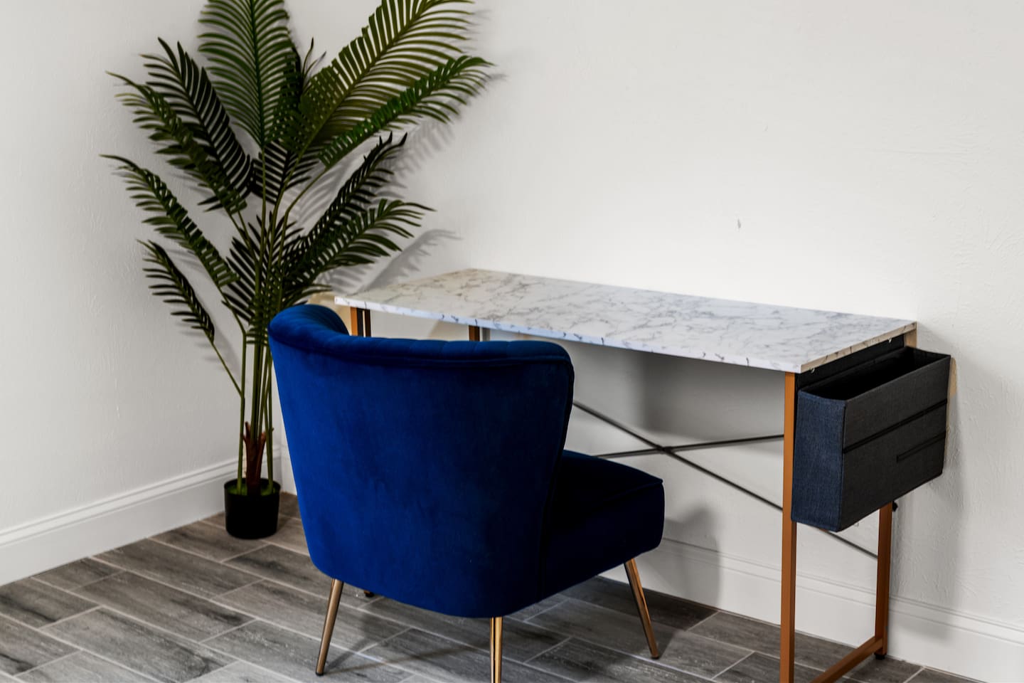 Need to sneak in a little work or study time? This chic marble-top desk and plush chair offer a comfortable and stylish workspace.