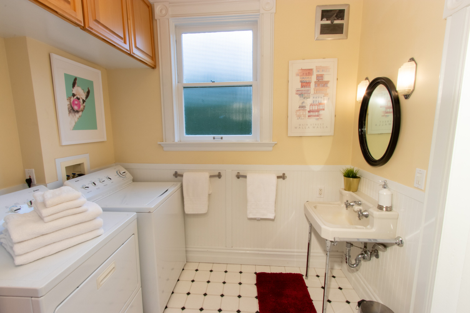 Bathroom #1 of 2: Main floor with walk-in shower and washer & dryer