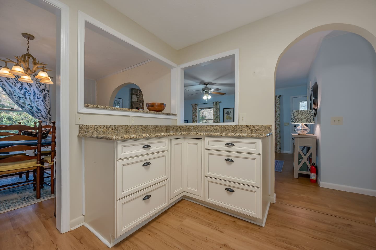 Updated kitchen with stainless steel appliances and countertops 