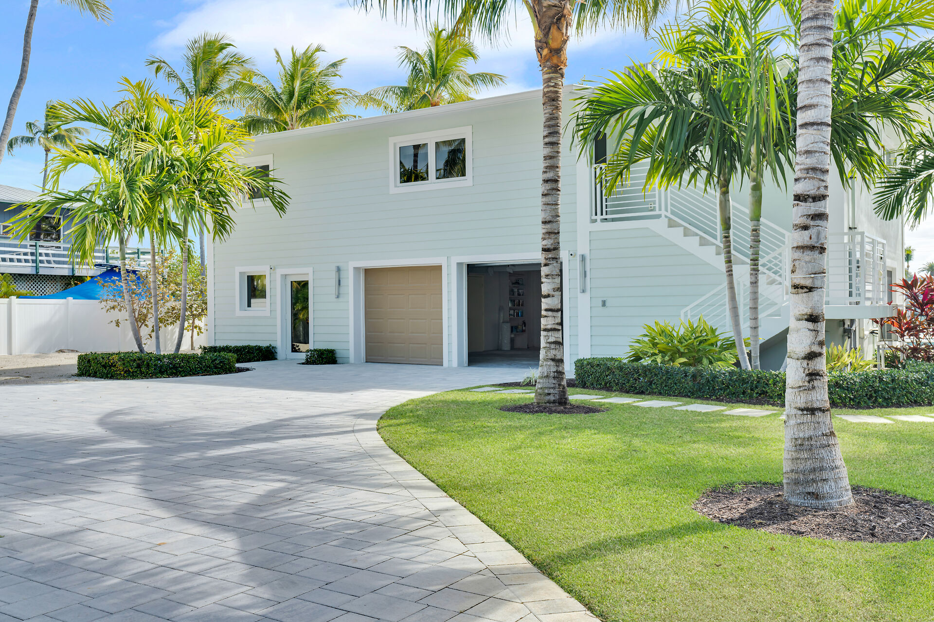 Gorgeous landscaping with Christmas and Queen Palms throughout the property.
