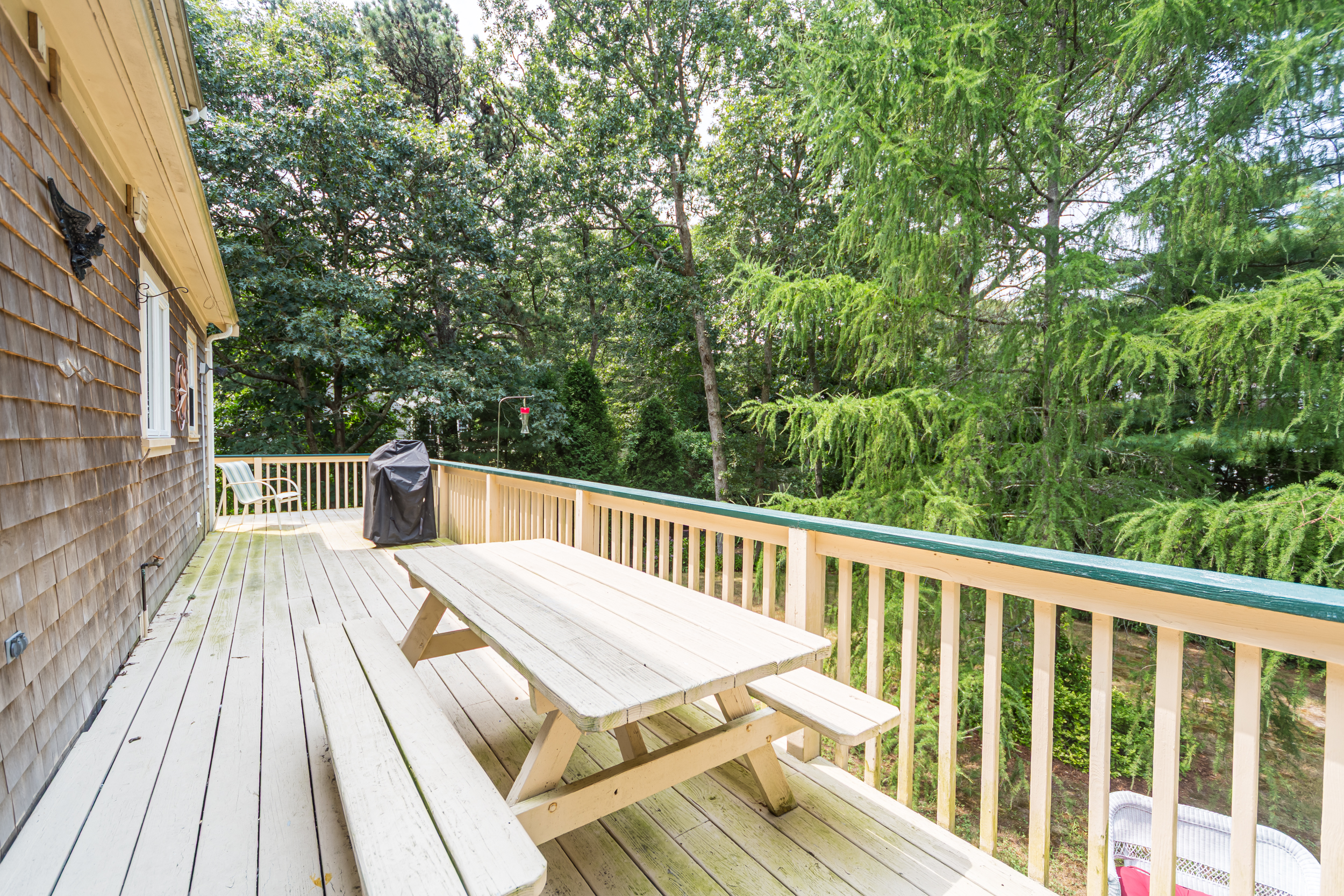 Spacious outdoor deck complete with grill and dining area.