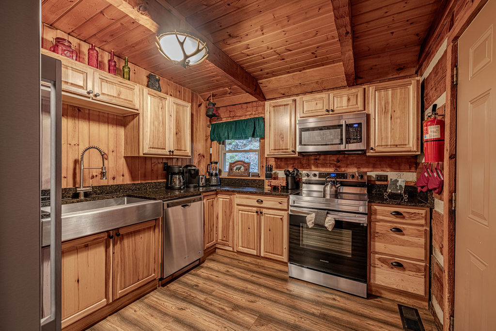 Fully equipped kitchen with stainless steel appliances and ample counter space