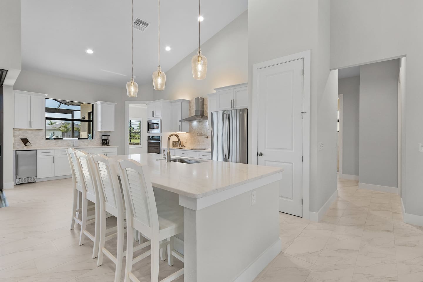 Indulge in a spacious gourmet kitchen featuring an elegant island that seats 4—perfect for entertaining guests or crafting exquisite meals in style!