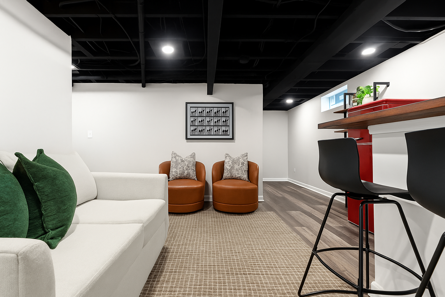 Relax downstairs with comfy seating, bar access, and a welcoming space perfect for movie nights or casual hangouts.