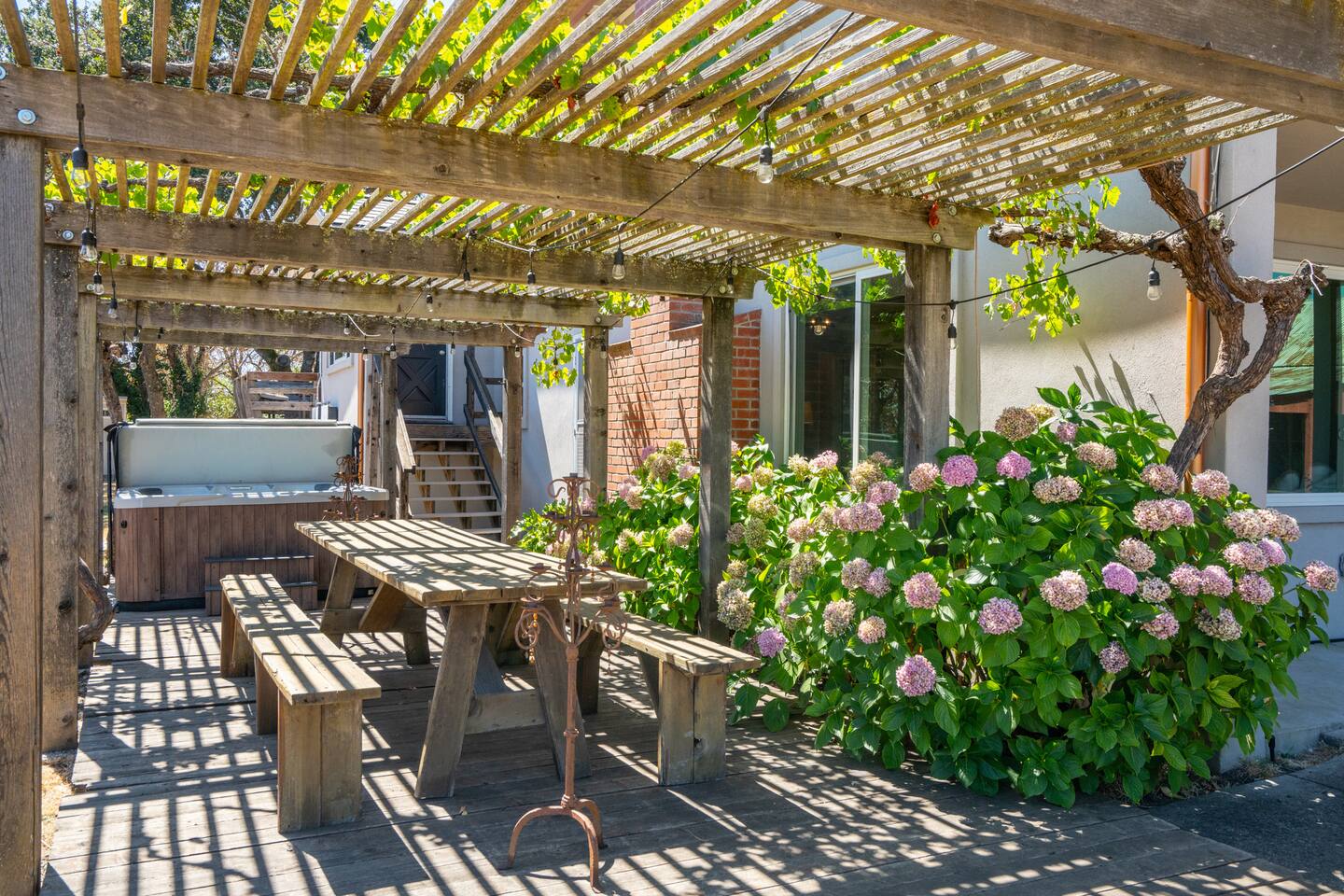 Dine al fresco or relax in the hot tub, embracing nature's beauty.