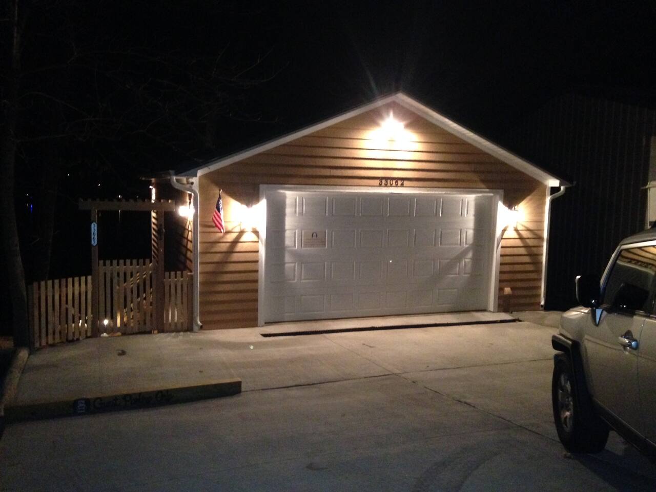 Concrete parking for Guests- please park to the left where designated. Owners do live under the garage, so keep the area in front of the garage doors clear.