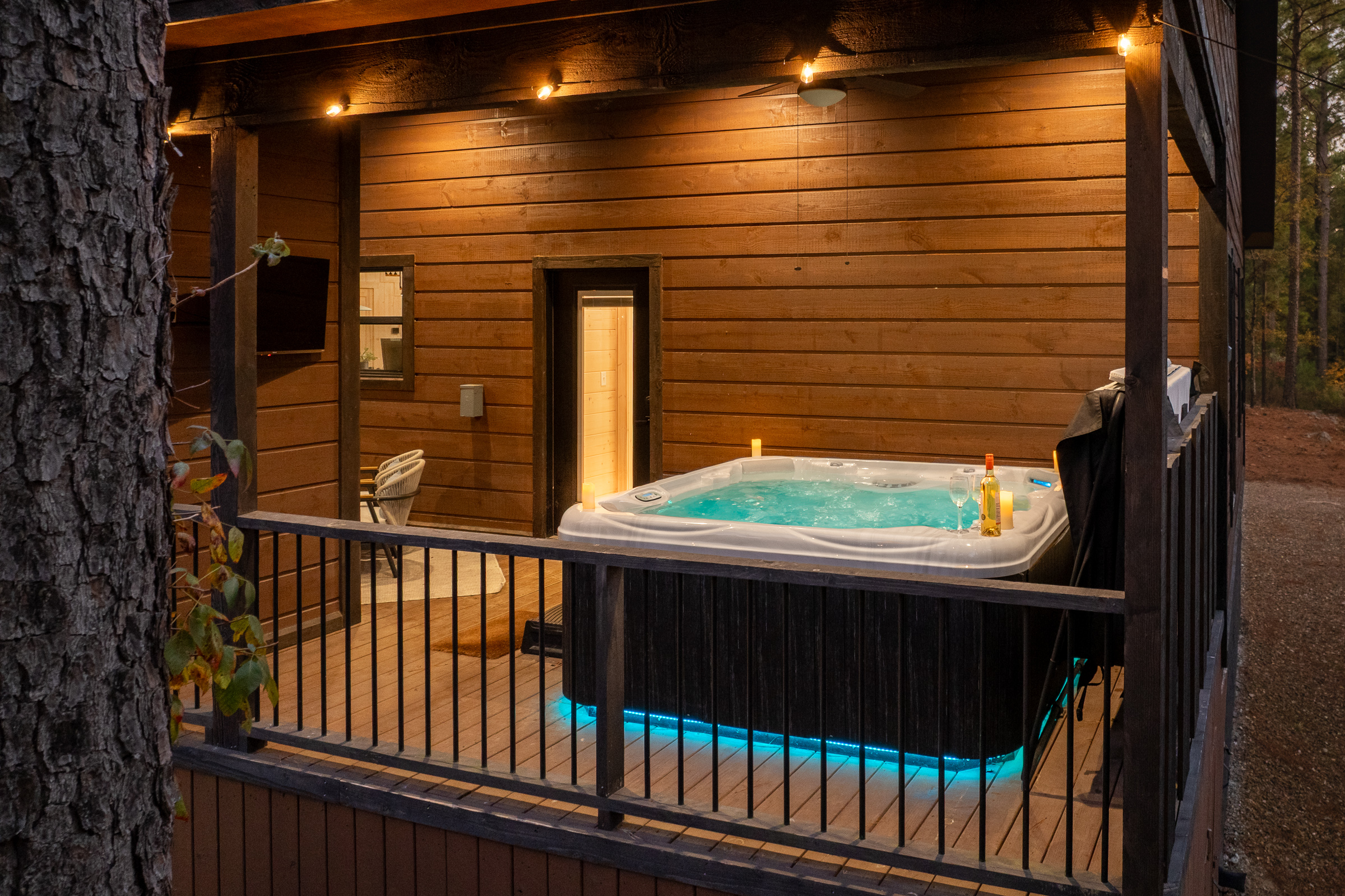 Evenings in the hot tub feel magical with warm lighting, soothing jets, and the quiet of the surrounding trees.