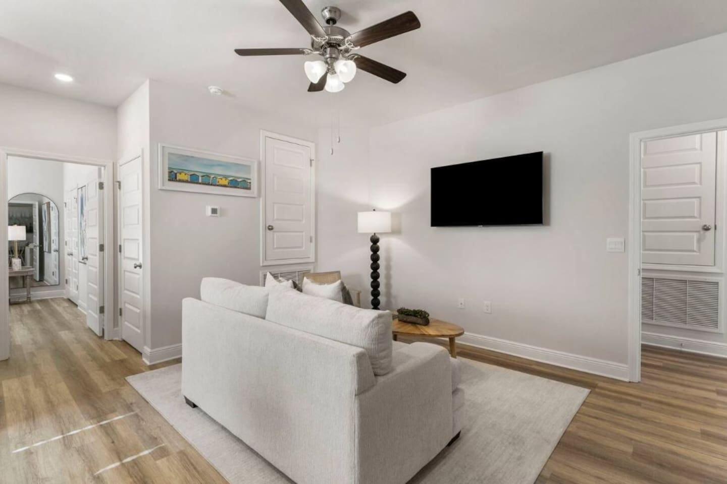 Additional entertainment area with comfy couch and smart TV.