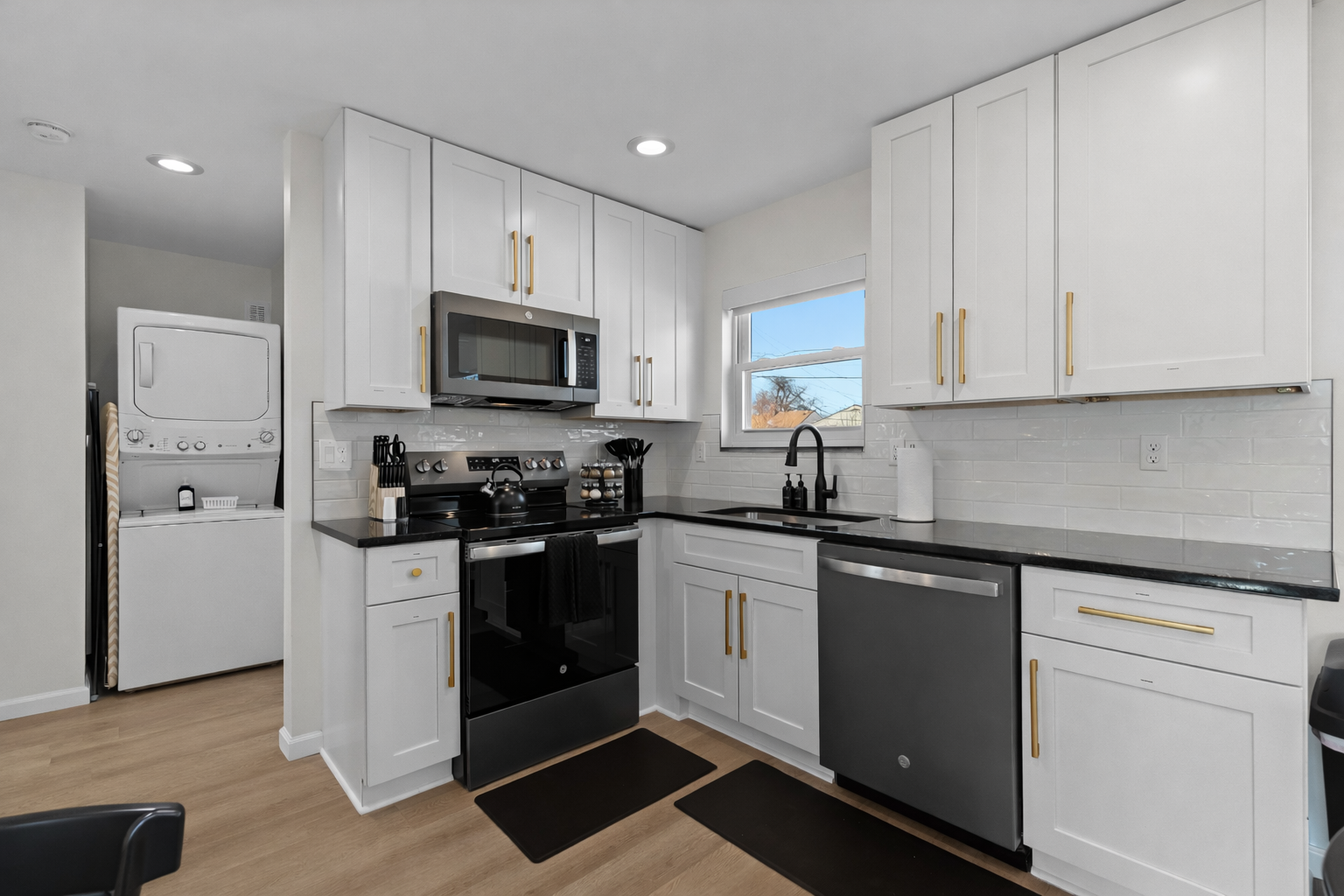 Bright, modern kitchen with full-size appliances, ample cabinet space, and sleek finishes—perfect for home cooking, meal prep, and longer stays.