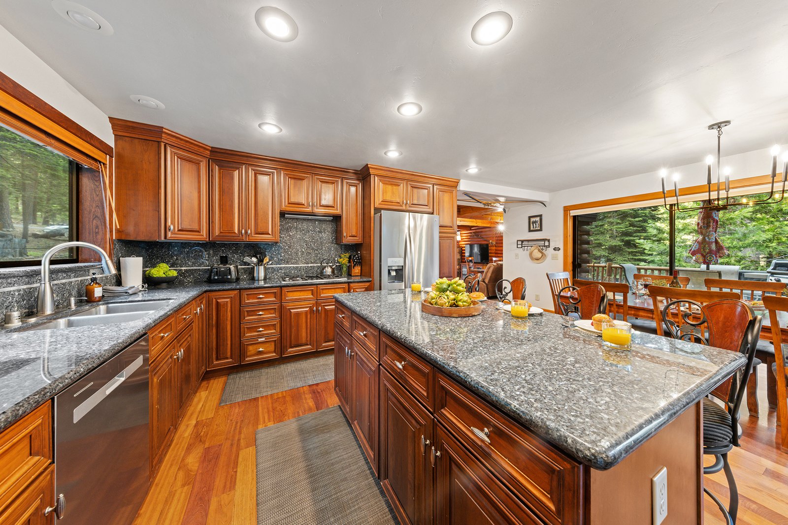 Keep the cook in the conversation — the island kitchen opens straight to the dining table and the fireside sofas.
