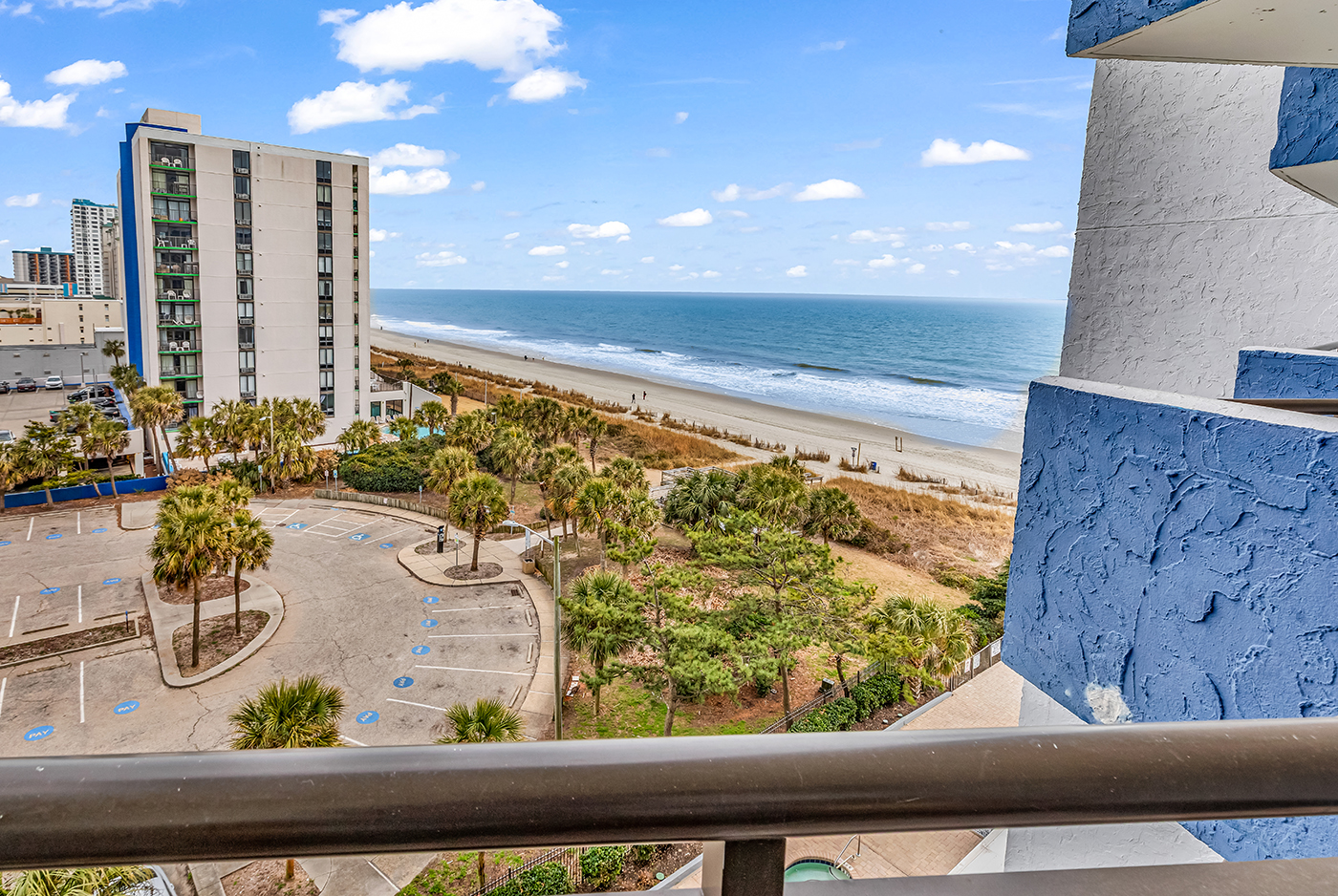 Wide ocean view from the balcony — take in the full panorama of the beach, pool area, and Atlantic coastline