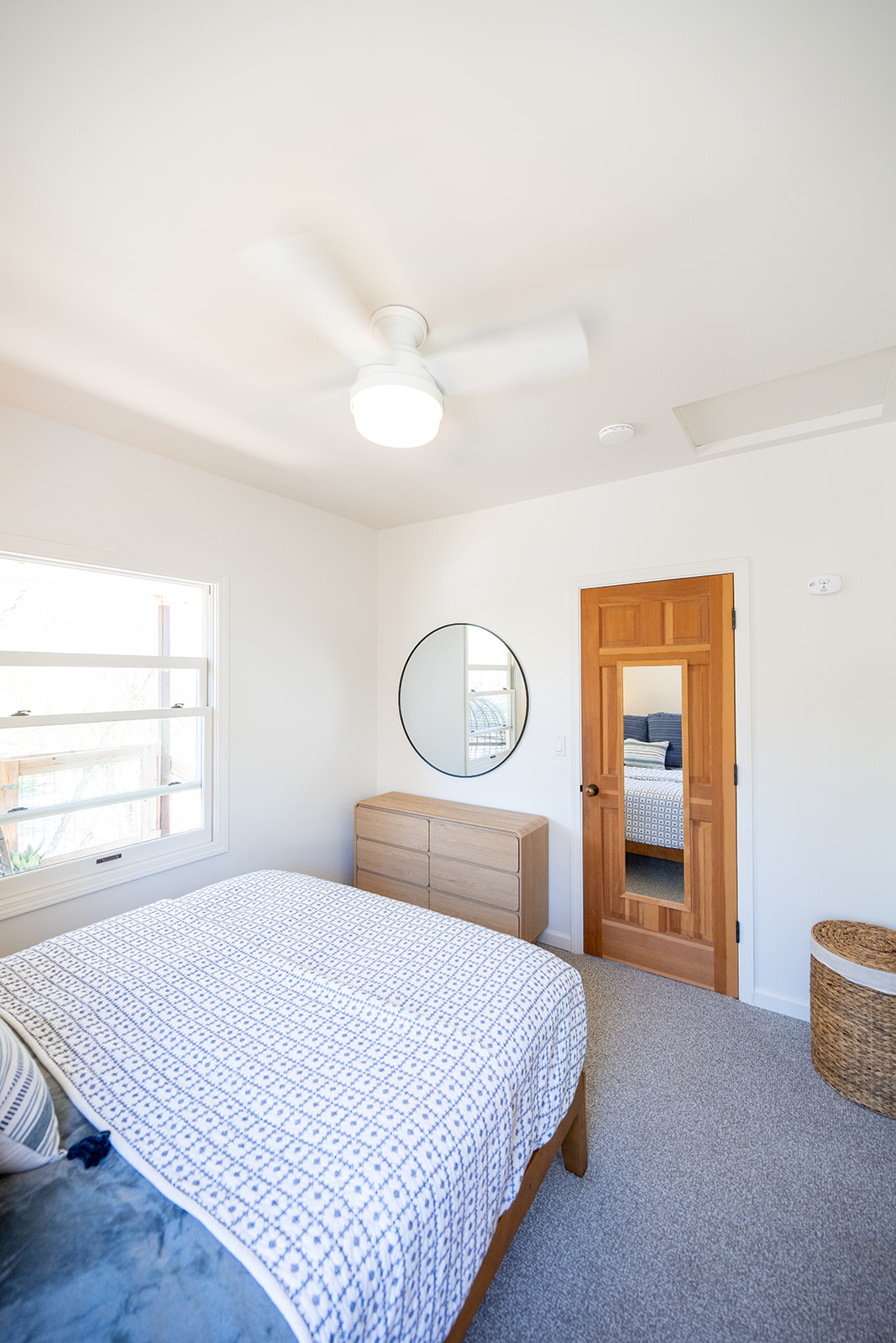 Comfortable bedroom featuring a queen bed, soft linens, and a calm setting for a restful night’s sleep