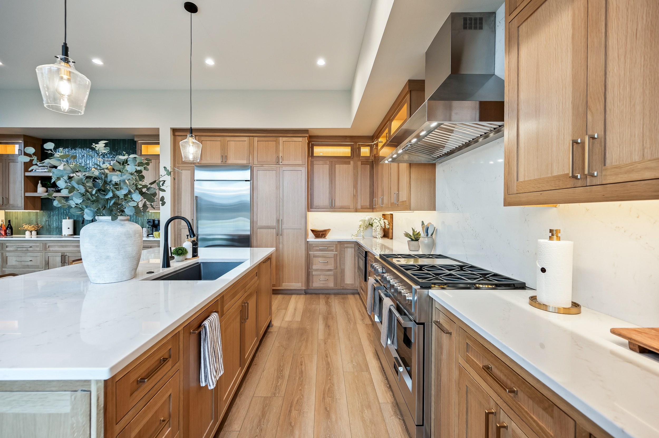 Dreamy chef's kitchen with custom cabinets, 6-burner gas stove, island seating, fully loaded with everything you need for your group. 