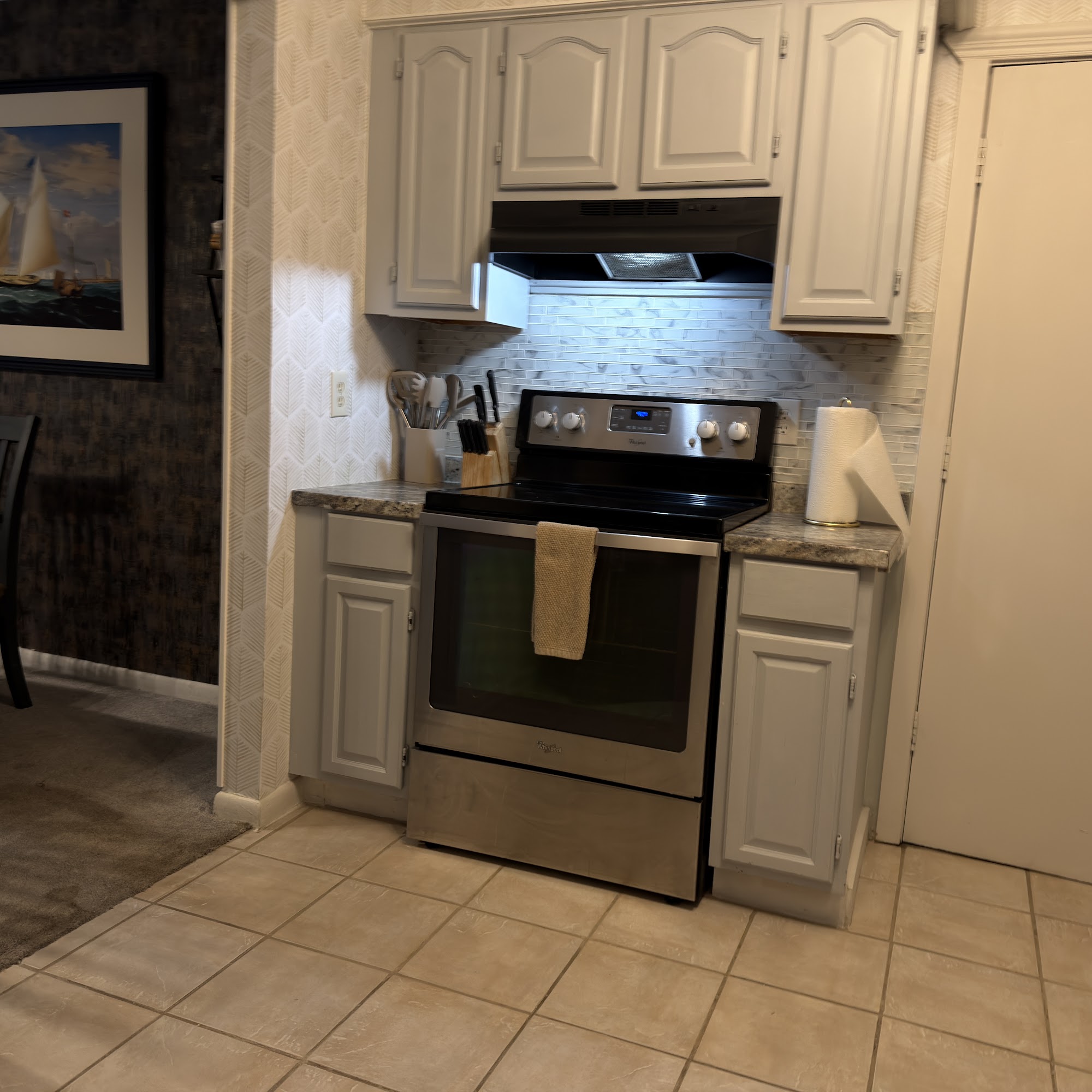 Stainless electric range with vent hood