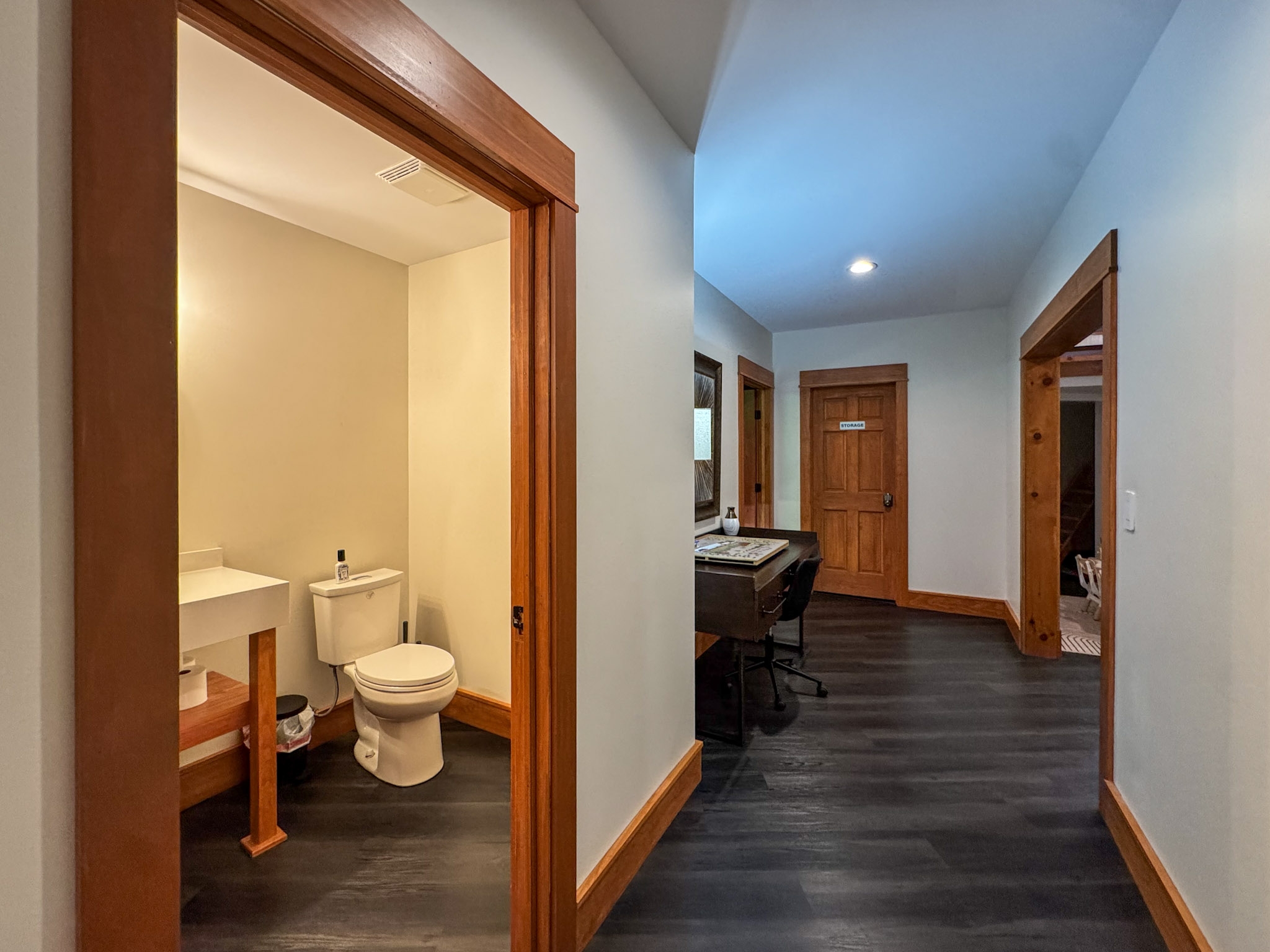 Downstairs half bath near the game room and theater.