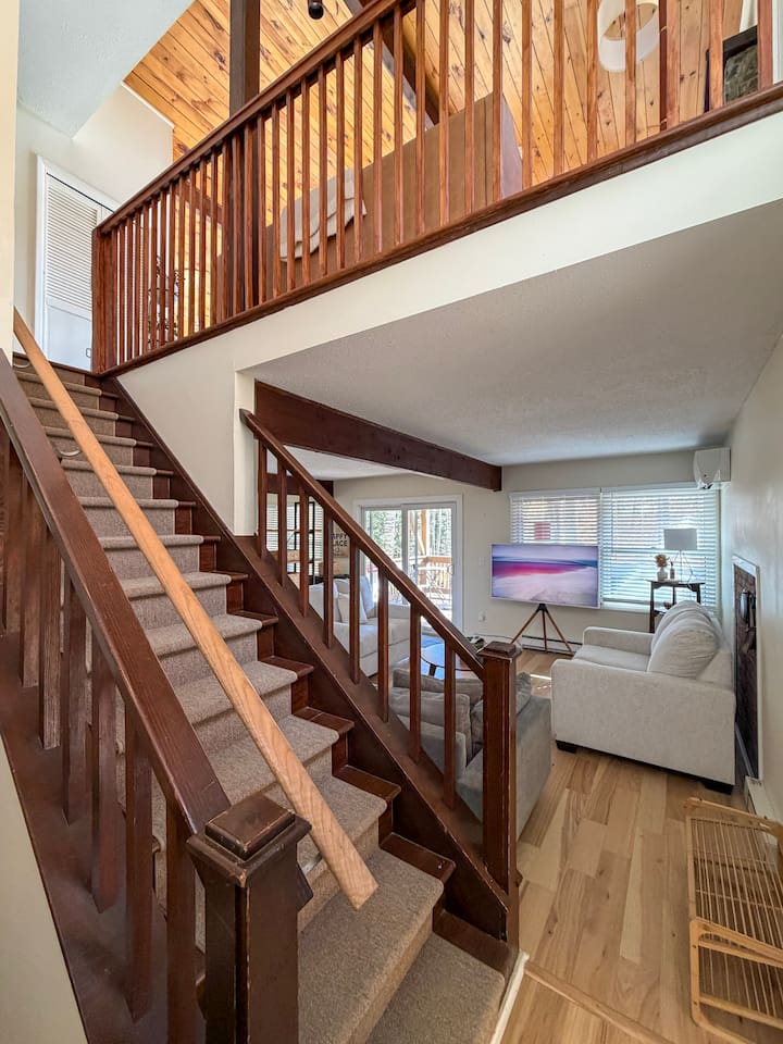 Stairs going up to the second floor (living room, dining room, kitchen, and primary bedroom suite)