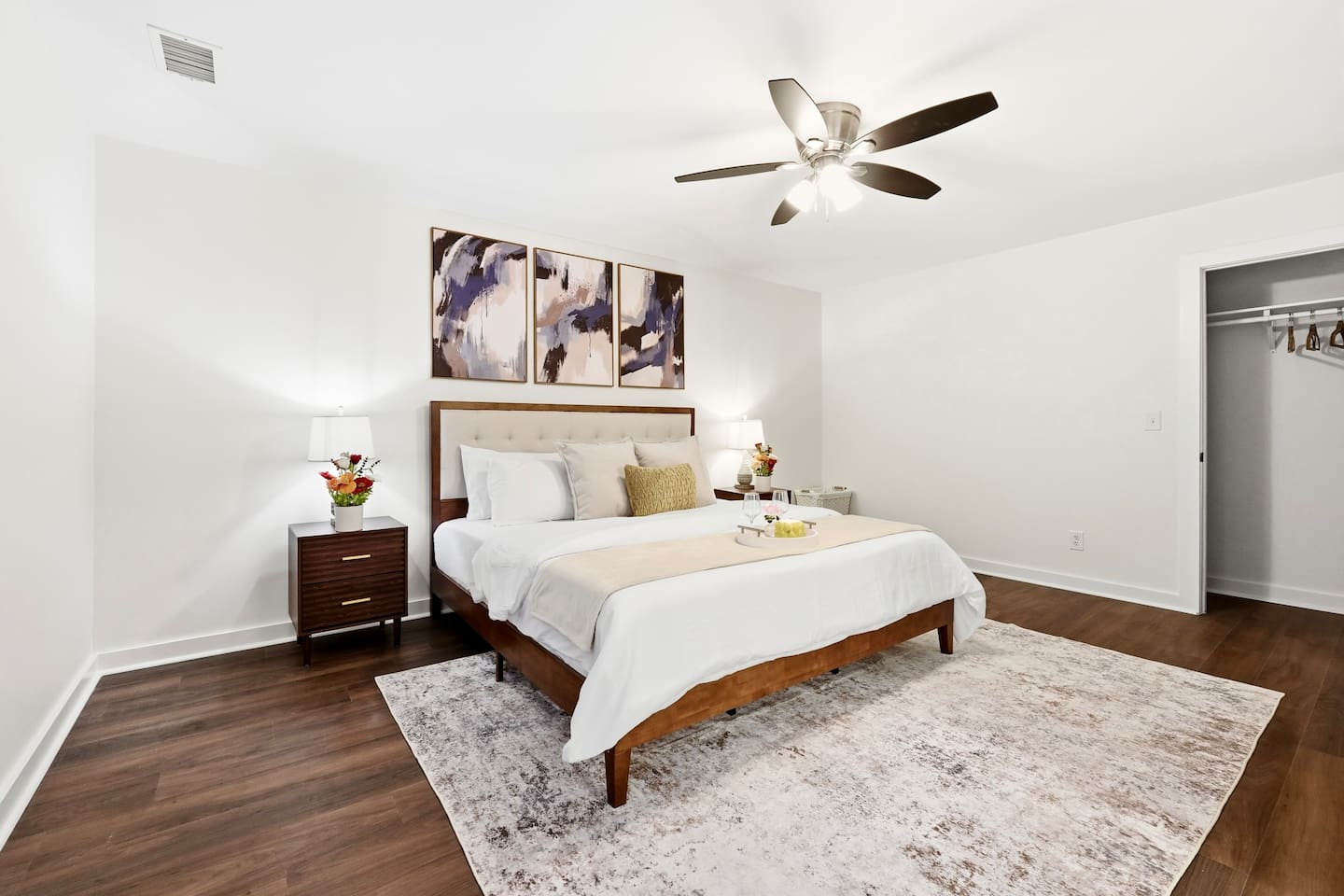 Cozy second-level bedroom featuring a king bed, a Roku-powered Smart TV, and located at the end of the hallway to the left at the top of the staircase. This room includes 2 full-body towels, 2 washcloths, and 2 hand towels for your stay.