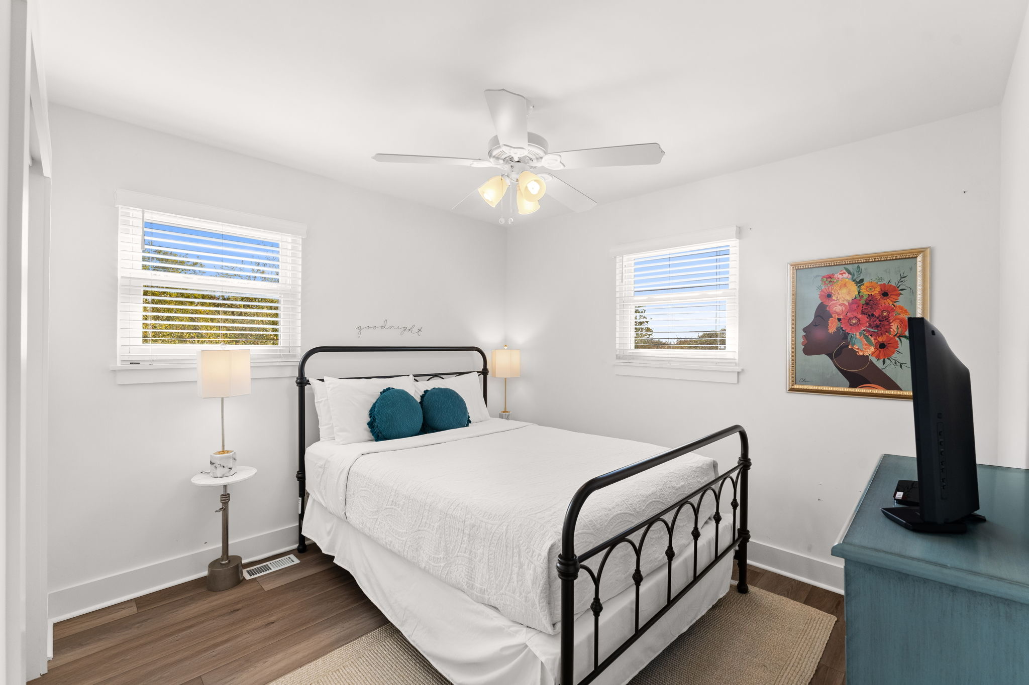 Side A: 3rd-fl This Guest room offers a smart TV and ceiling fan for those quiet moments.