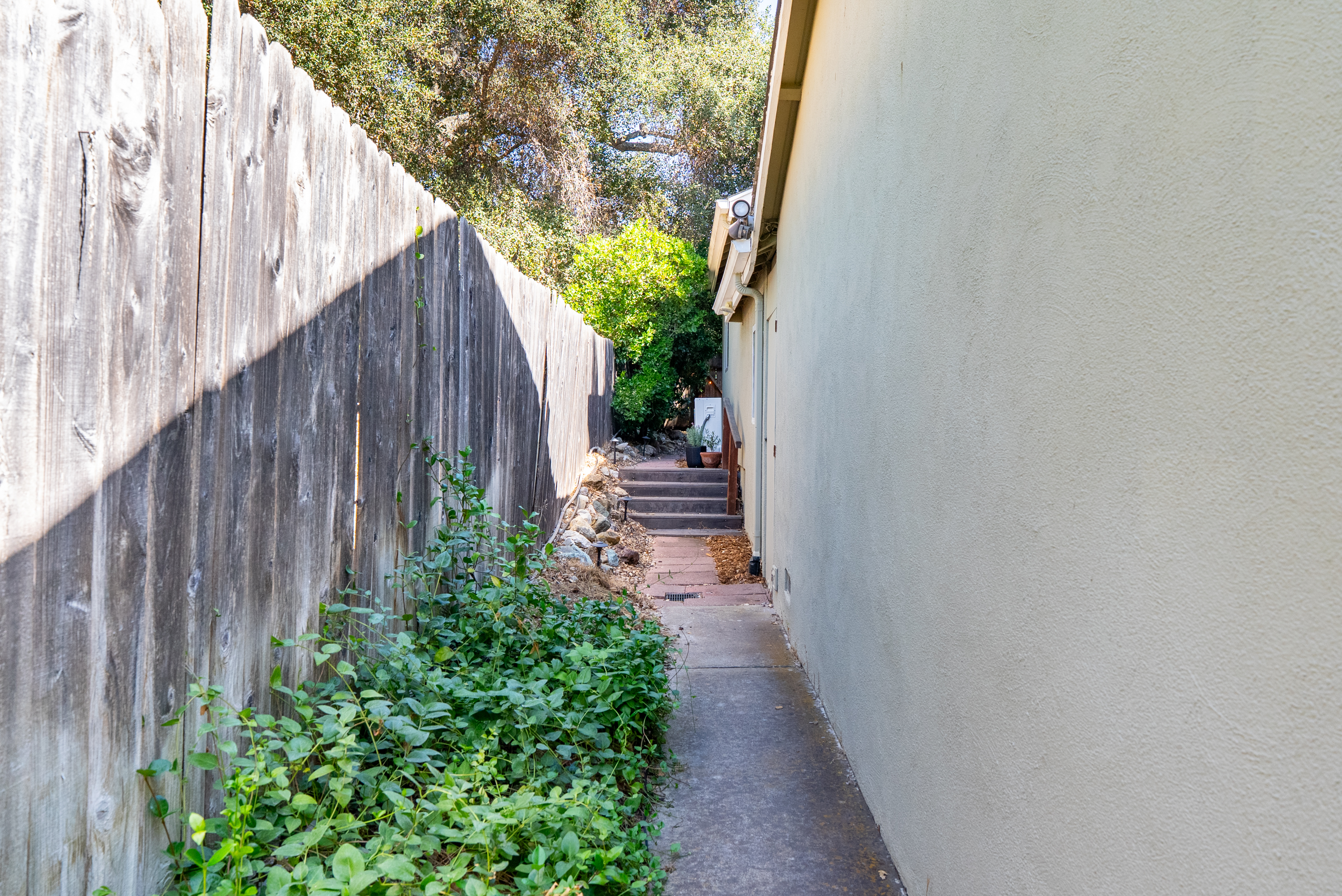 Walkway to studio unit behind gate