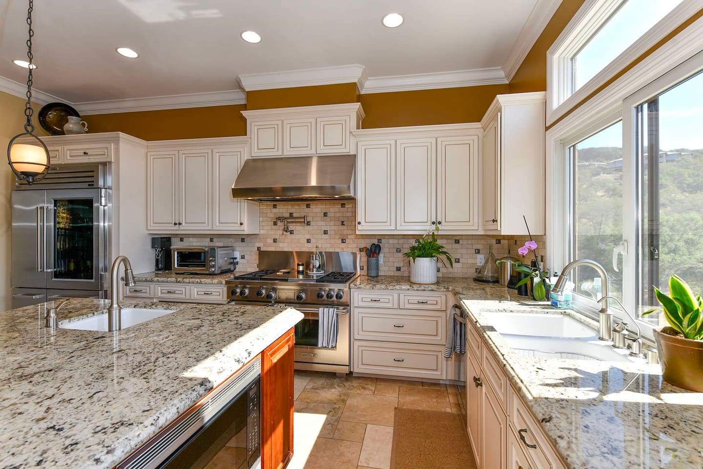 Fully stocked kitchen with 4 person dining table and 4 person kitchen island seating.