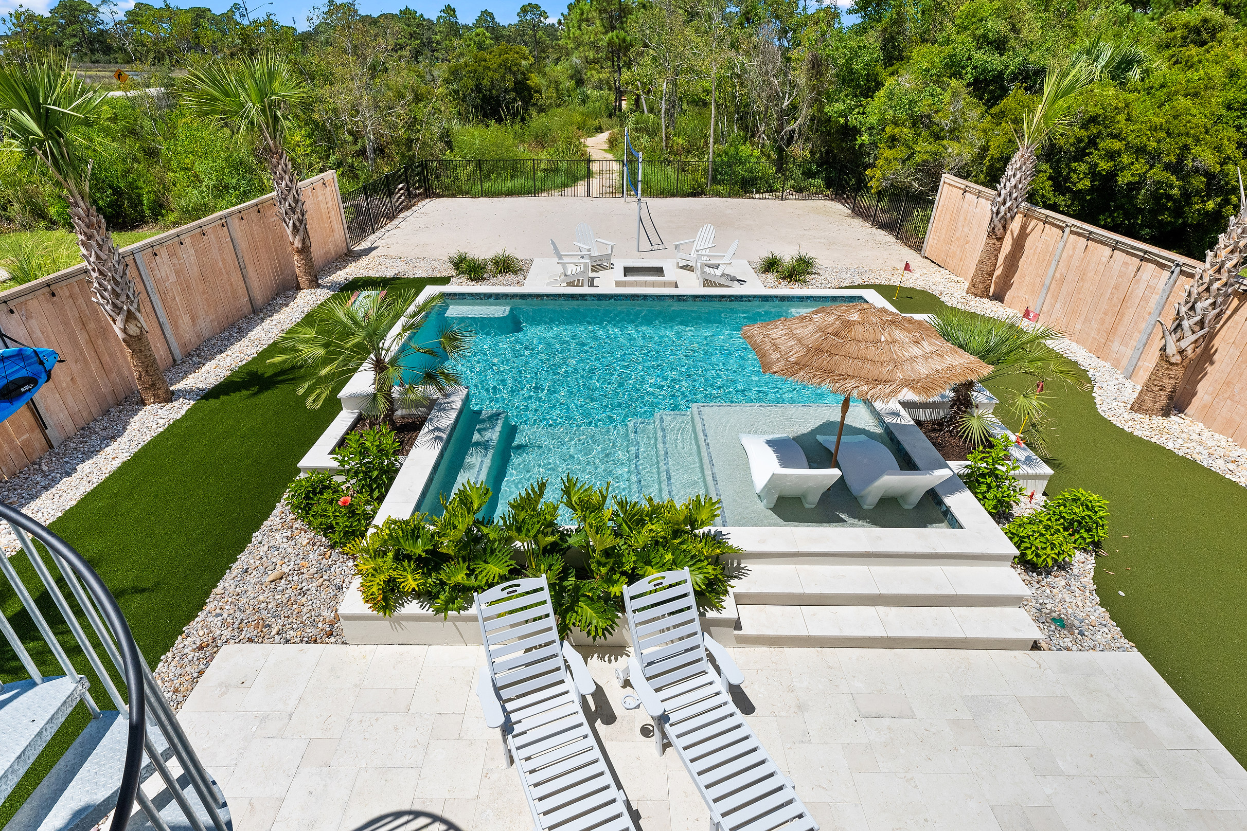 Look out over the private pool and backyard from the upper balcony.
