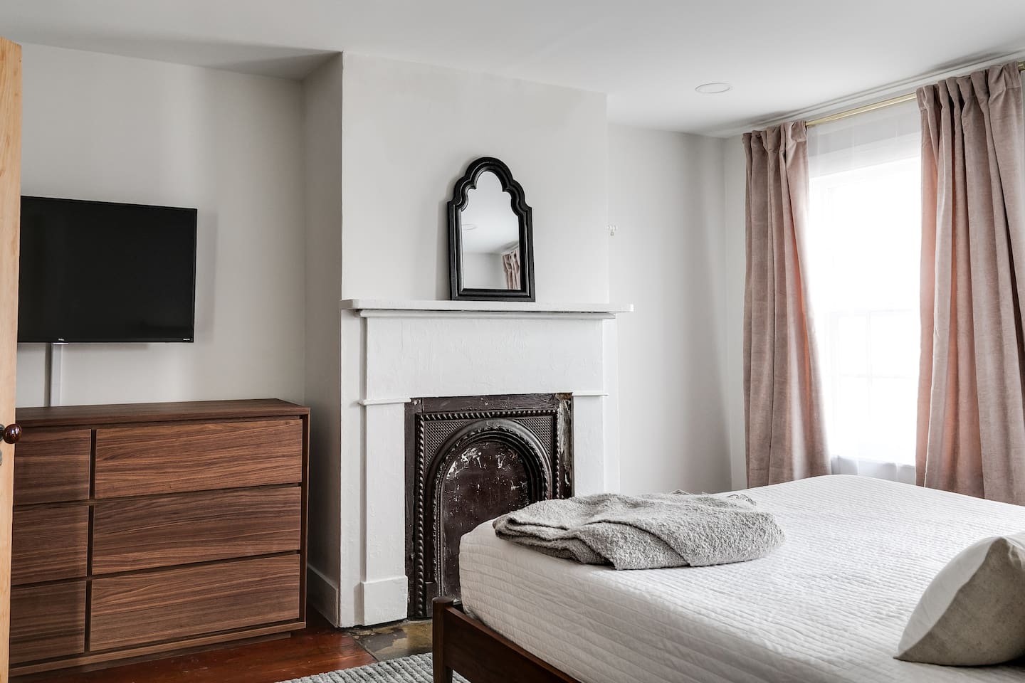 2nd Floor Queen Bedroom: Bright retreat with elegant decor, plush bedding, and a sleek TV for relaxation!
