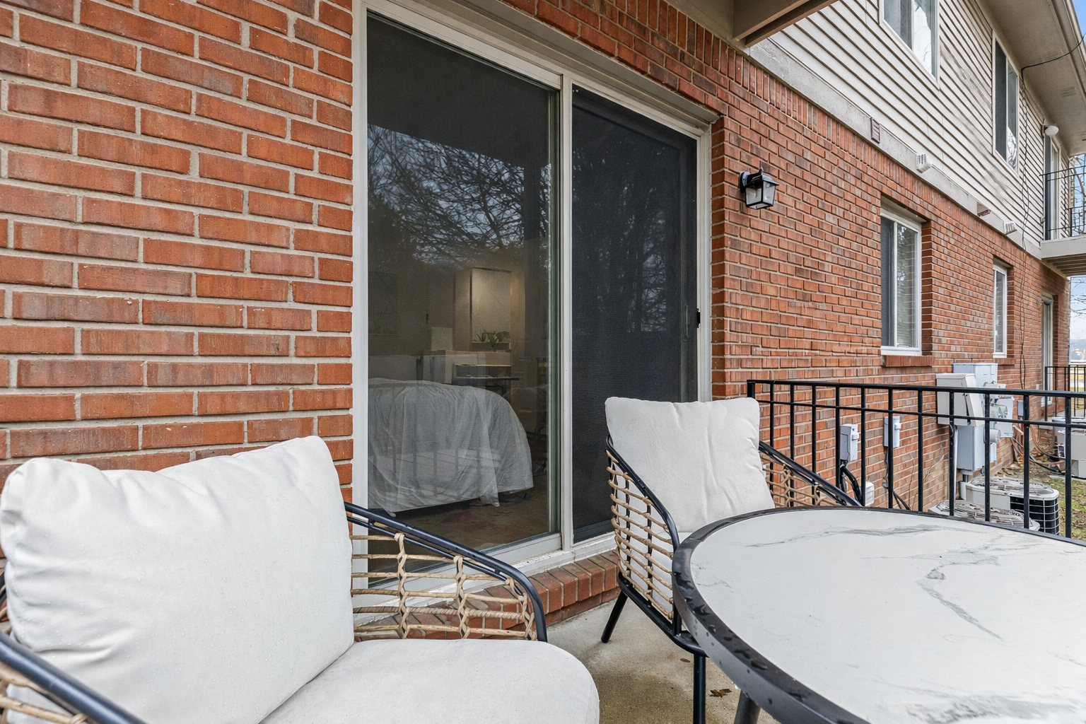 Private patio with comfortable seating, perfect for enjoying a quiet morning coffee or unwinding in the evening.