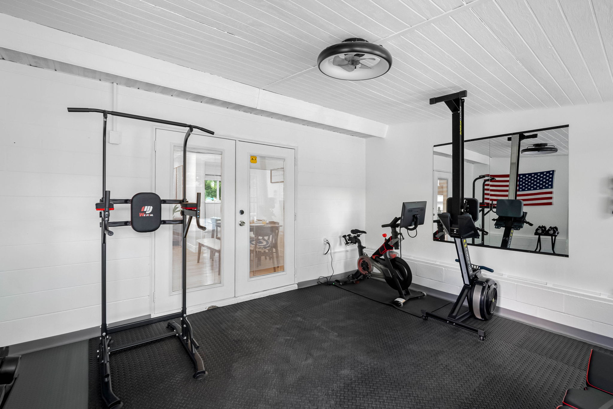 Peloton bike, rower, bench, power tower, free weights—everything you need for a full workout.