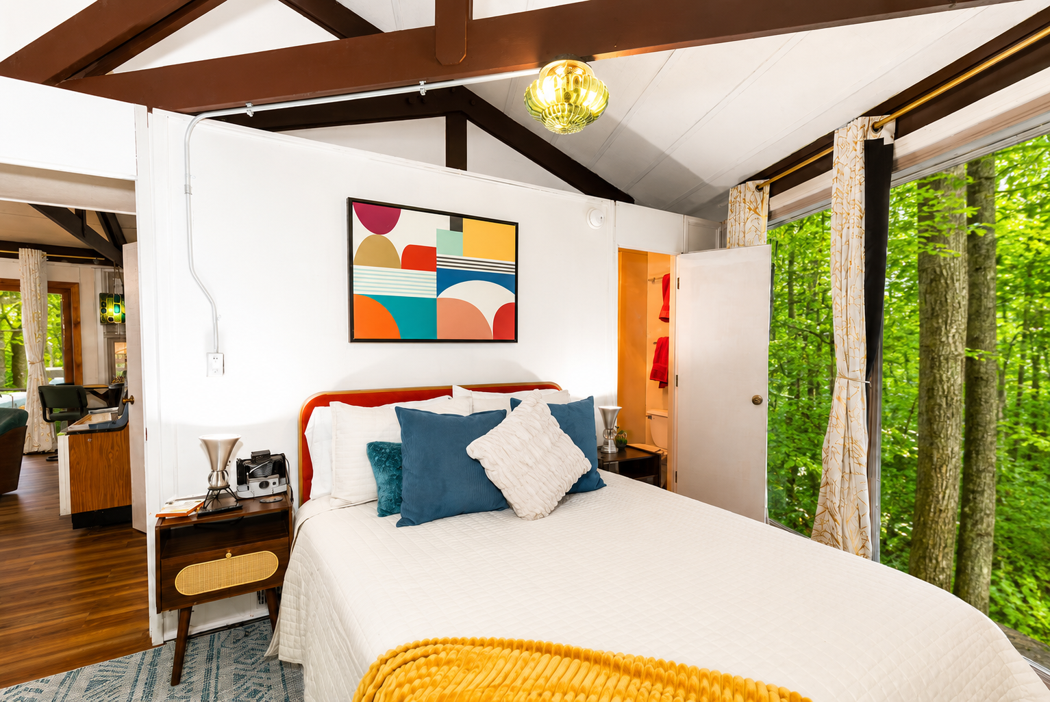 Bedroom with ensuite bathroom, wooded views. Queen Bed