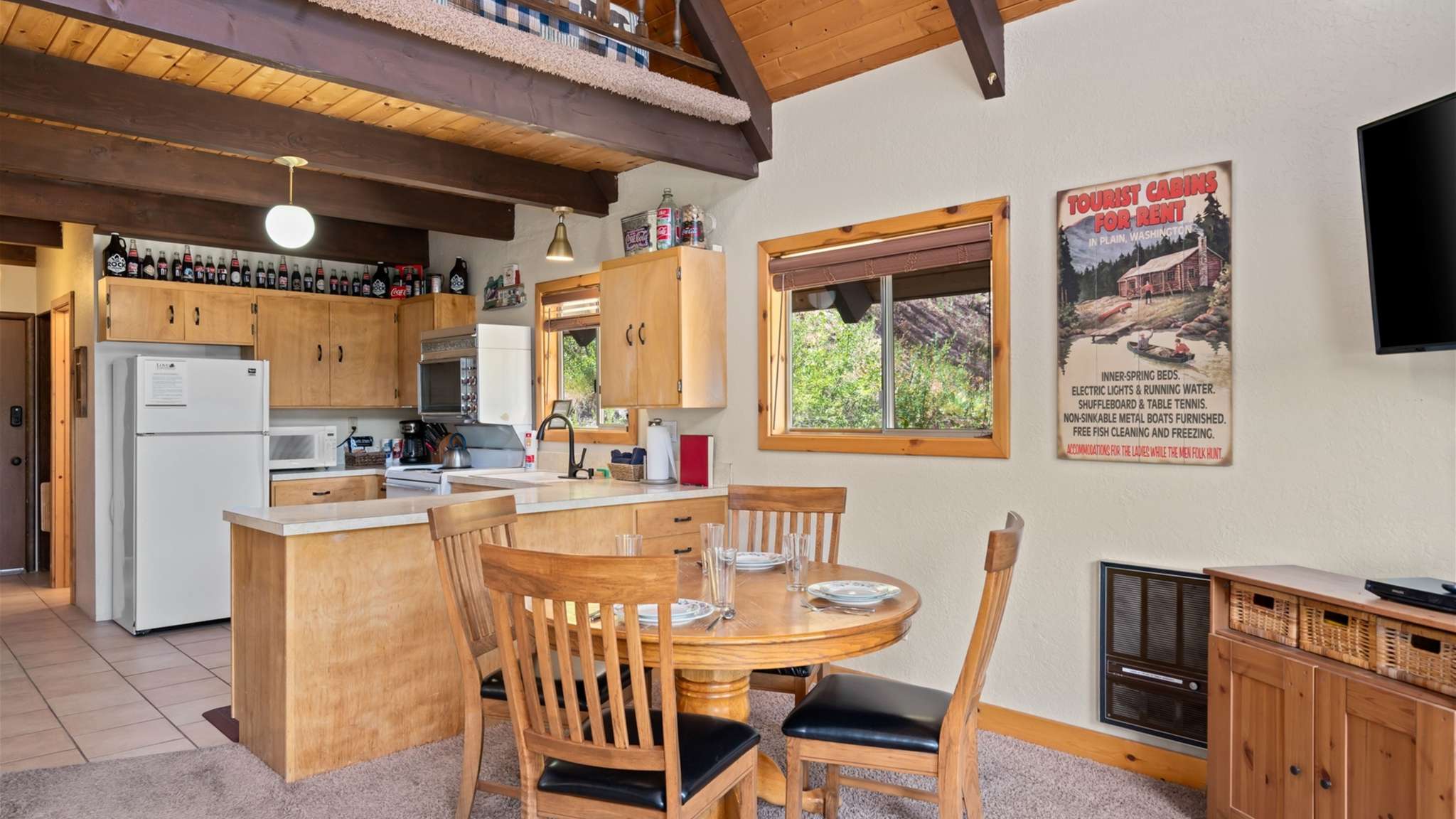 Dining area with mountain views and lots of natural light.