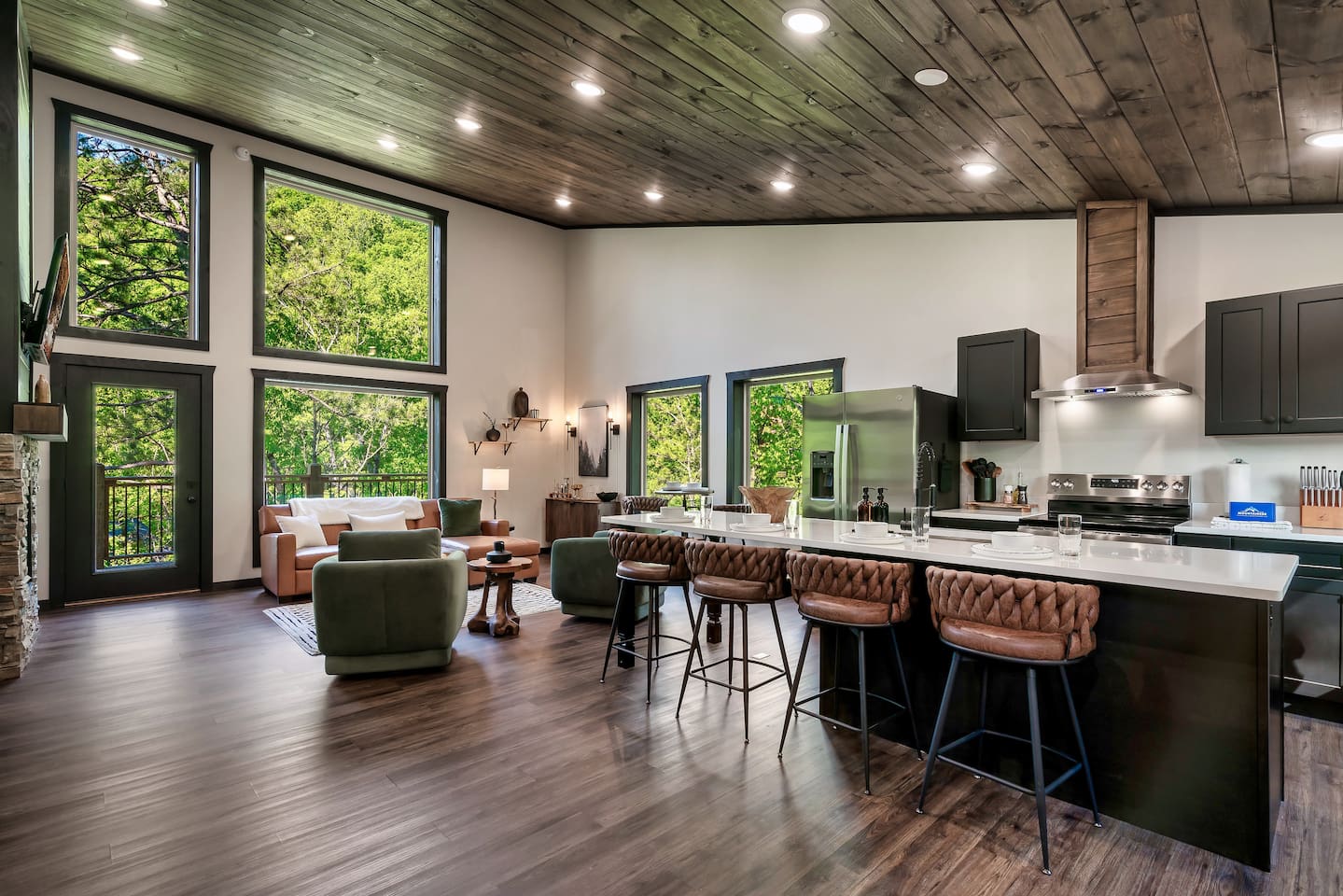 Spacious open-concept layout with large kitchen island and soaring ceilings.