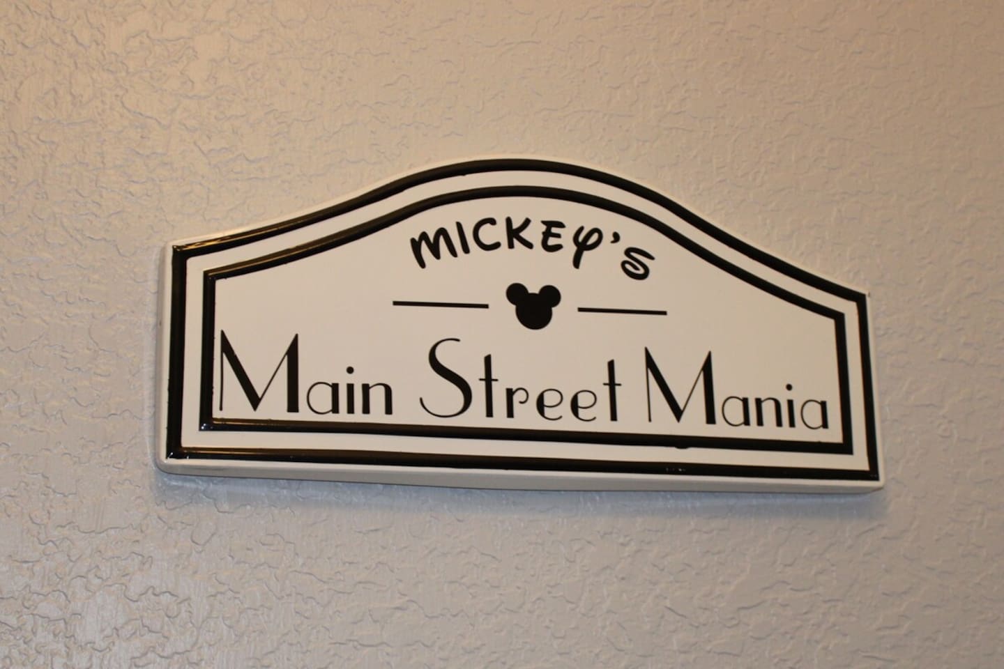- Mickey’s Main Street Mania sign sets the tone for a fun filled Disney getaway  
- Adds a cheerful welcome for guests upon entering this themed retreat  
- Creates a sense of excitement for the magical stay ahead  