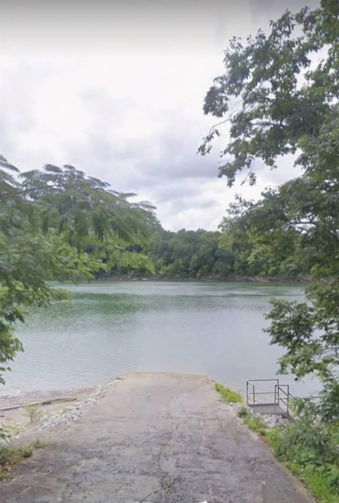 The neighborhood boat ramp features easy access for launching boats, plus metal stairs that lead down to the shoreline for fishing, wading, or enjoying the water up close.