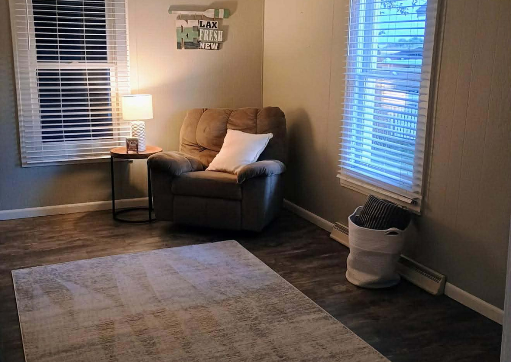 Living room with comfy chair to sit in. 
