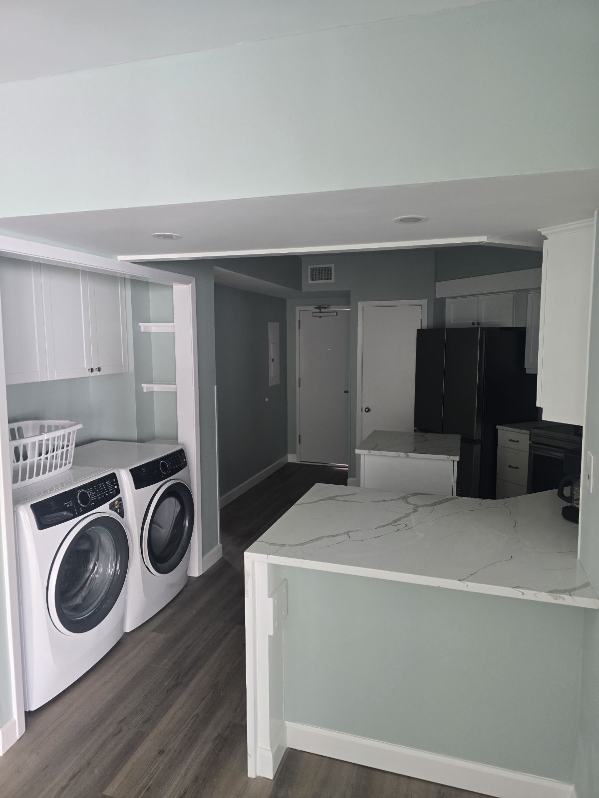 Brand New Everything!  Kitchen view with the updated Laundry station.