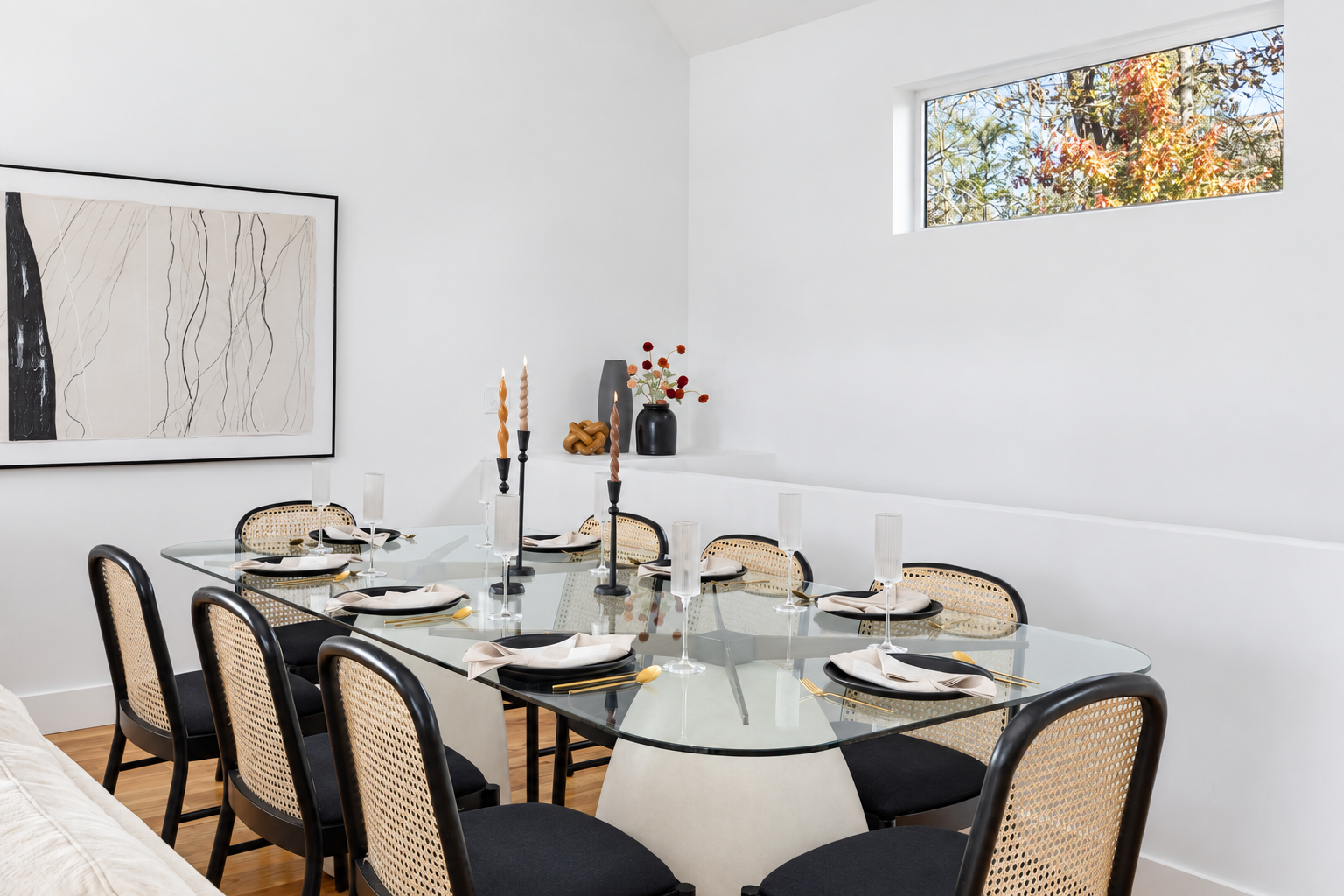 {Dining Room} A beautifully styled glass dining table with seating for your whole group—perfect for shared meals and celebrations.