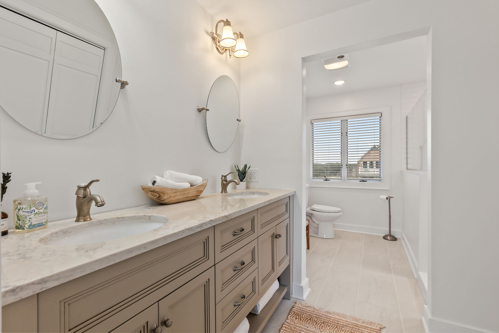 Ensuite King Br Bathroom with double vanity, large mirror, and plenty of space for getting ready.
