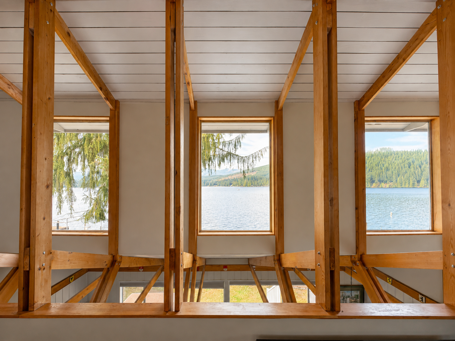 Bedroom 1 King. Wake up to beautiful lake and mountain views from the king bedroom, with a peaceful scene right outside your window.