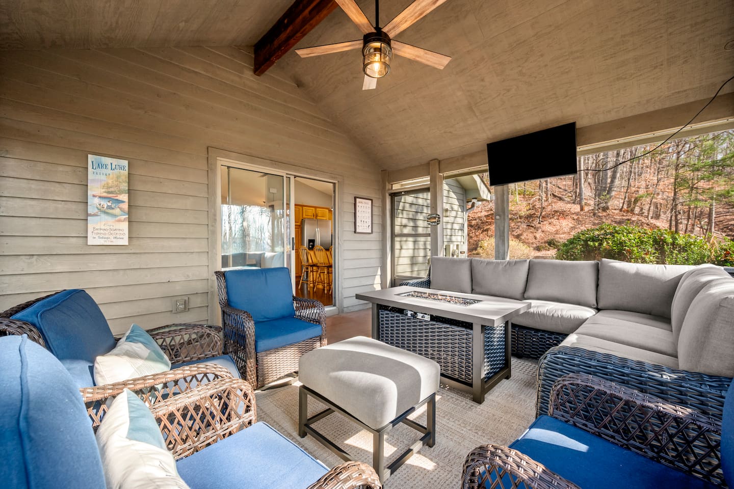 Open screened in porch with seating, tv, and more