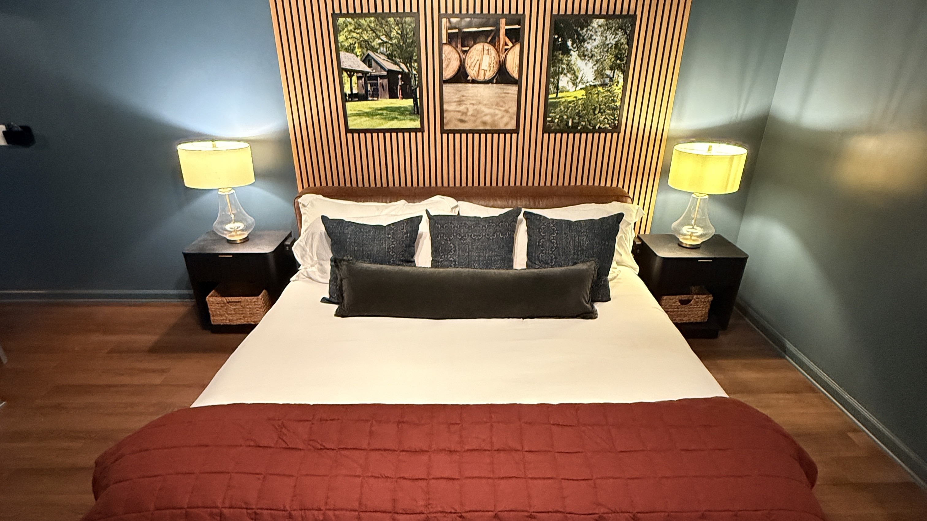 Curated with a collector’s eye and crafted for modern comfort — this bourbon-inspired bedroom pairs rich textures and tailored design with your host’s own framed photography, offering an atmosphere of refined warmth and executive ease.